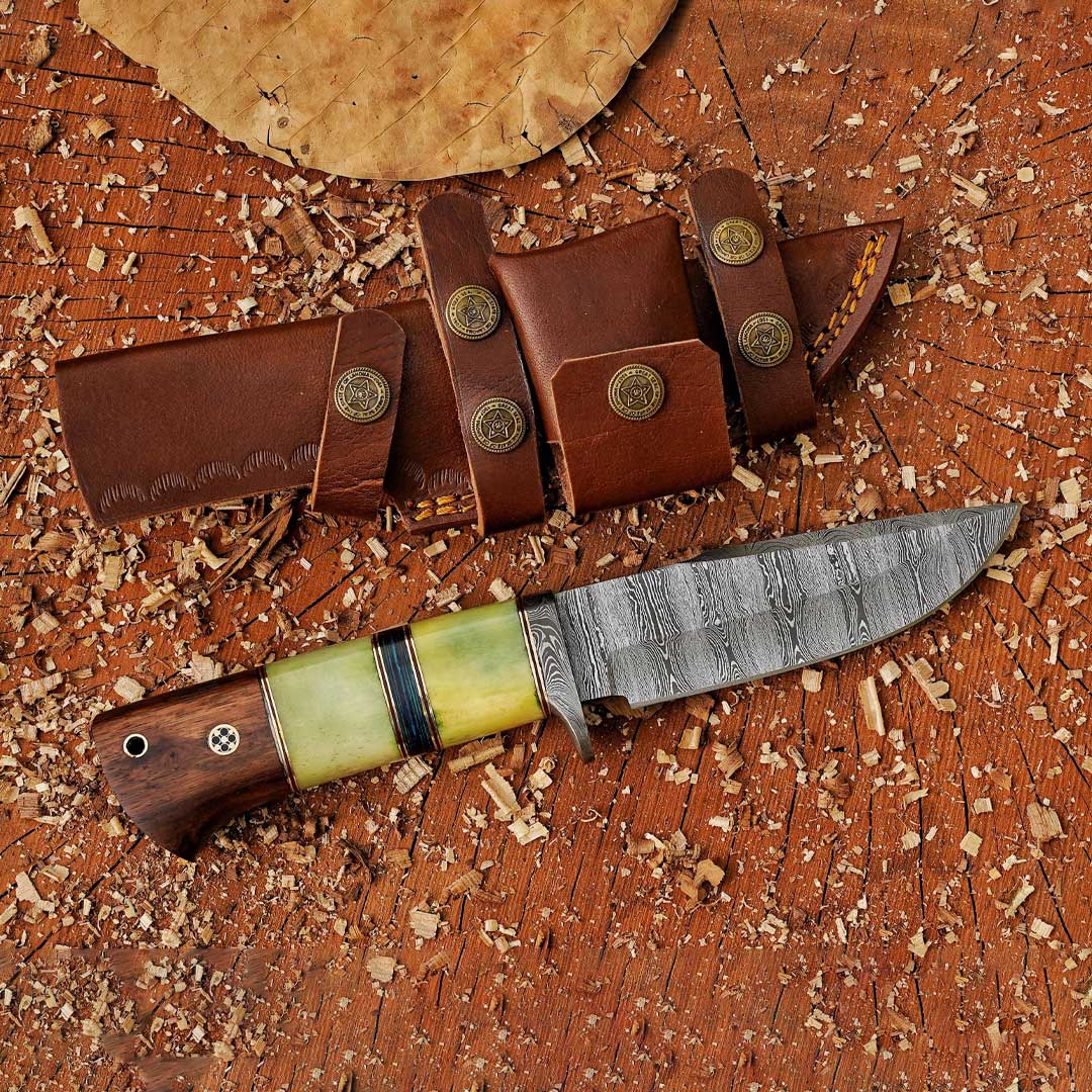 A hand forged Damascus steel hunting knife with a wooden and bone handle, a leather sheath, and a striped blade.