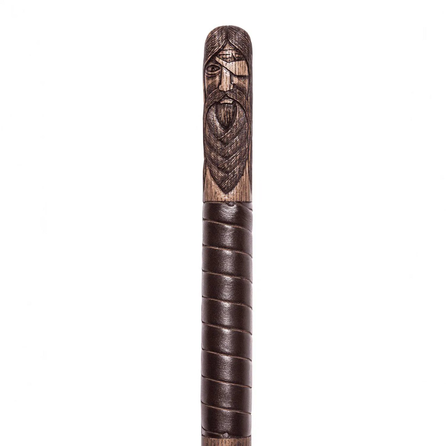 Wooden staff with carved face and leather wrapping on a white background