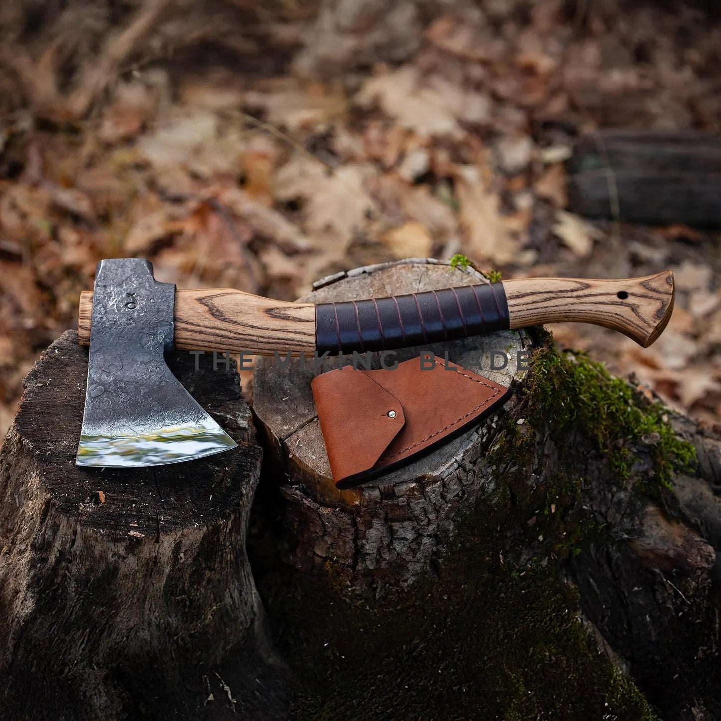 Axes with leather sheathes on a wooden stump in a forest setting