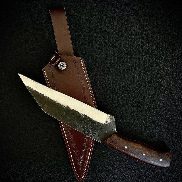 This Carbon Steel Seax Knife is a handmade fixed blade knife featuring a beautiful rosewood handle and a cowhide leather sheath. Built from high-quality carbon steel, this knife delivers excellent sharpness and durability for everyday outdoor use and collectors alike.