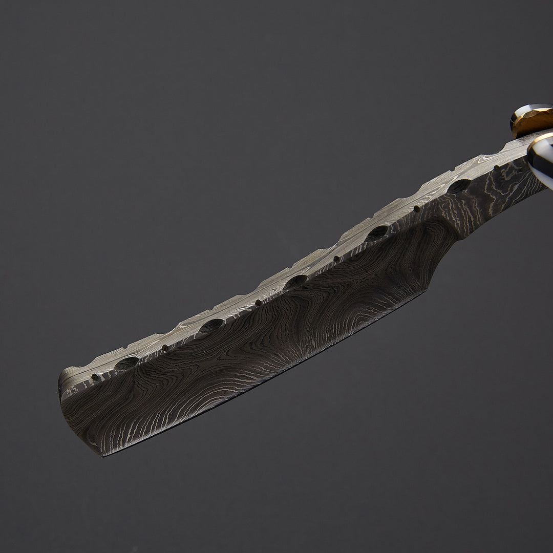Classic barber straight razor displayed in open and closed form showing folding mechanism and handcrafted metal detailing.