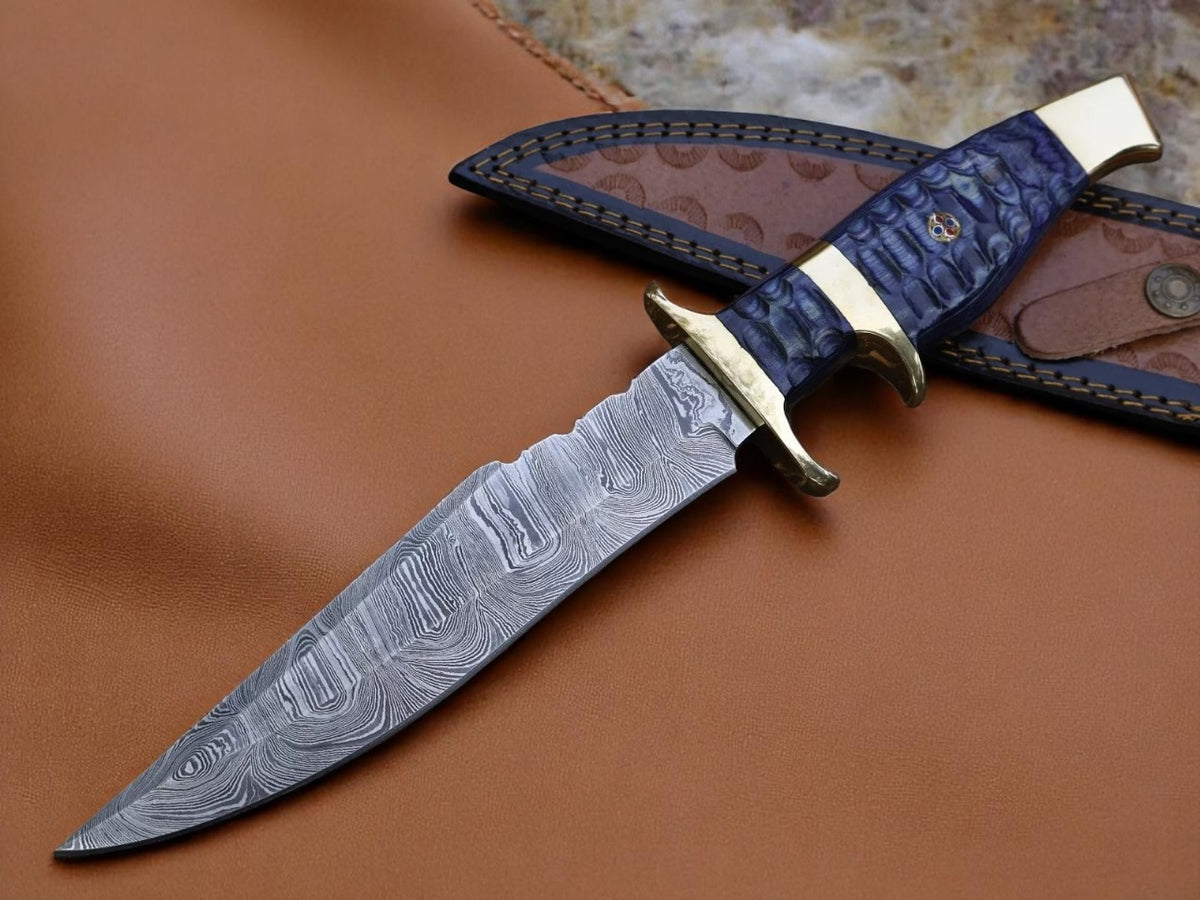 A custom handmade Damascus steel hunting knife with a brown leather sheath. The knife features a patterned blade and a dark handle with a metal guard.