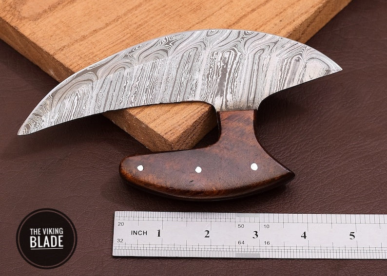 Artisan handmade Damascus Ulu knife paired with premium leather sheath and wooden holder