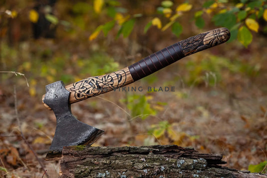 Decorative axe with wooden handle on a log in a forest setting