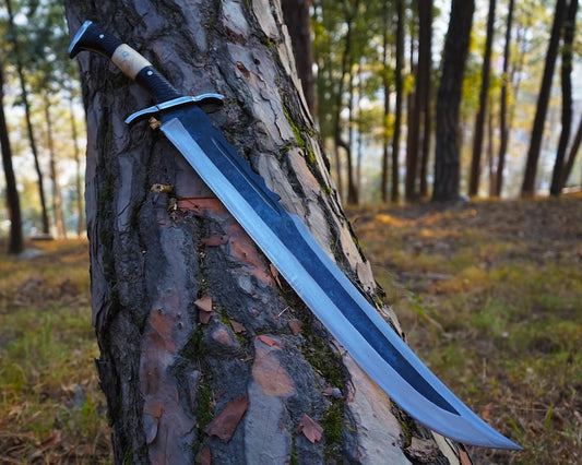 Sword embedded in a tree trunk in a forest setting