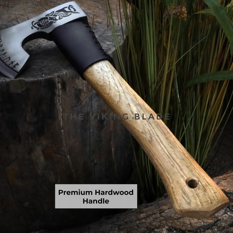 Axes with wooden handles on a stone surface