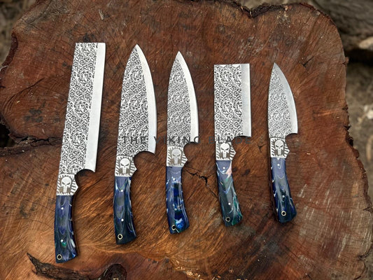 Five knives with decorative patterns on a wooden surface