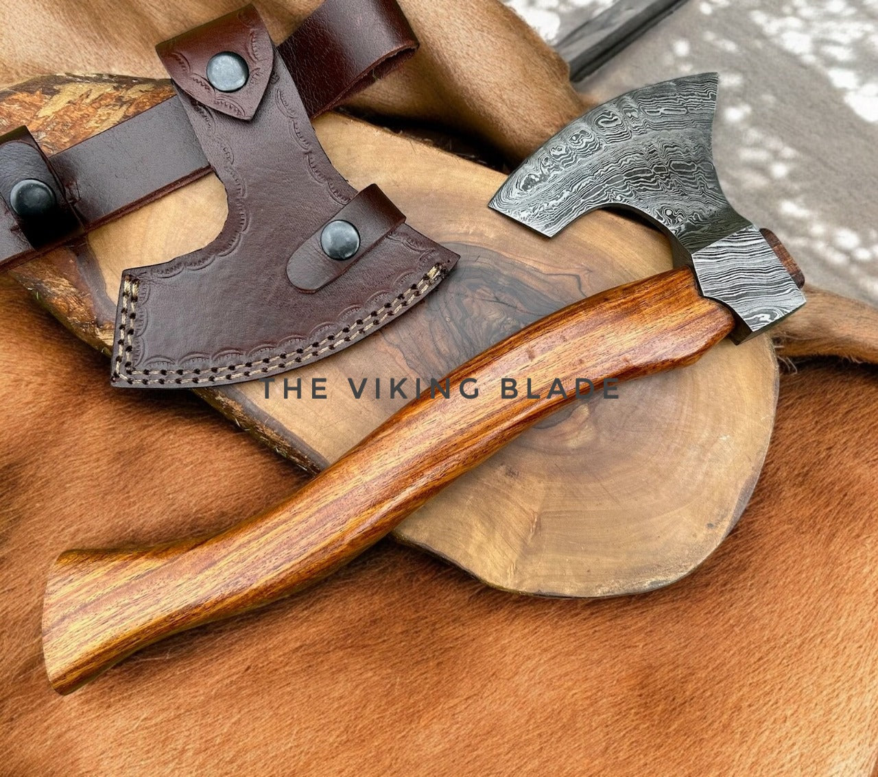 Wooden axe with leather sheath on a wooden surface