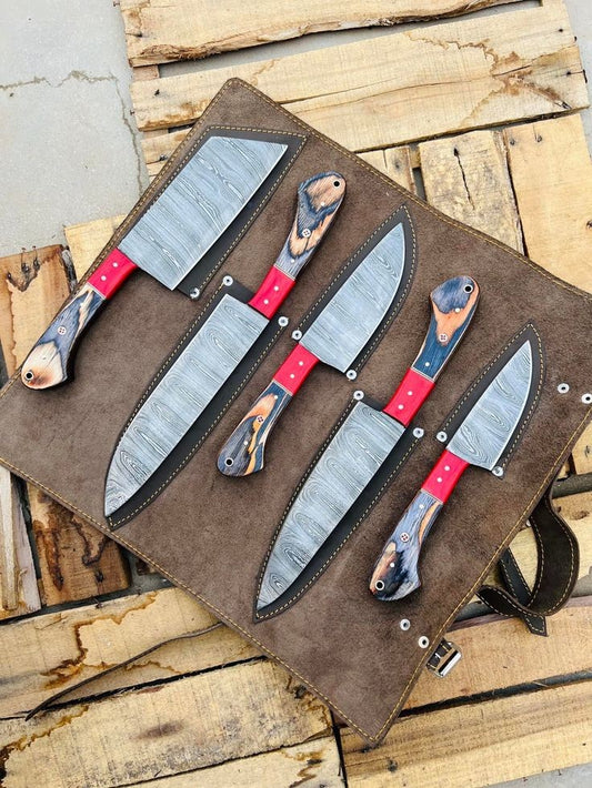 A set of kitchen knives with wooden handles and steel blades, displayed on a brown leather roll kit.