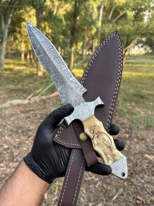 Hand holding with a leather sheath outdoors