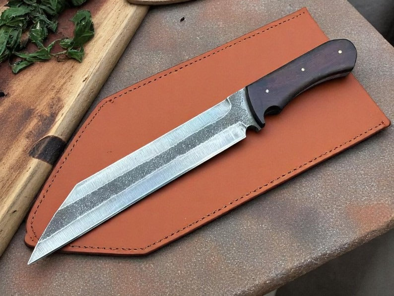 A custom handmade hunting seax knife with a striped pattern blade, wooden handle, and a natural leather sheath.