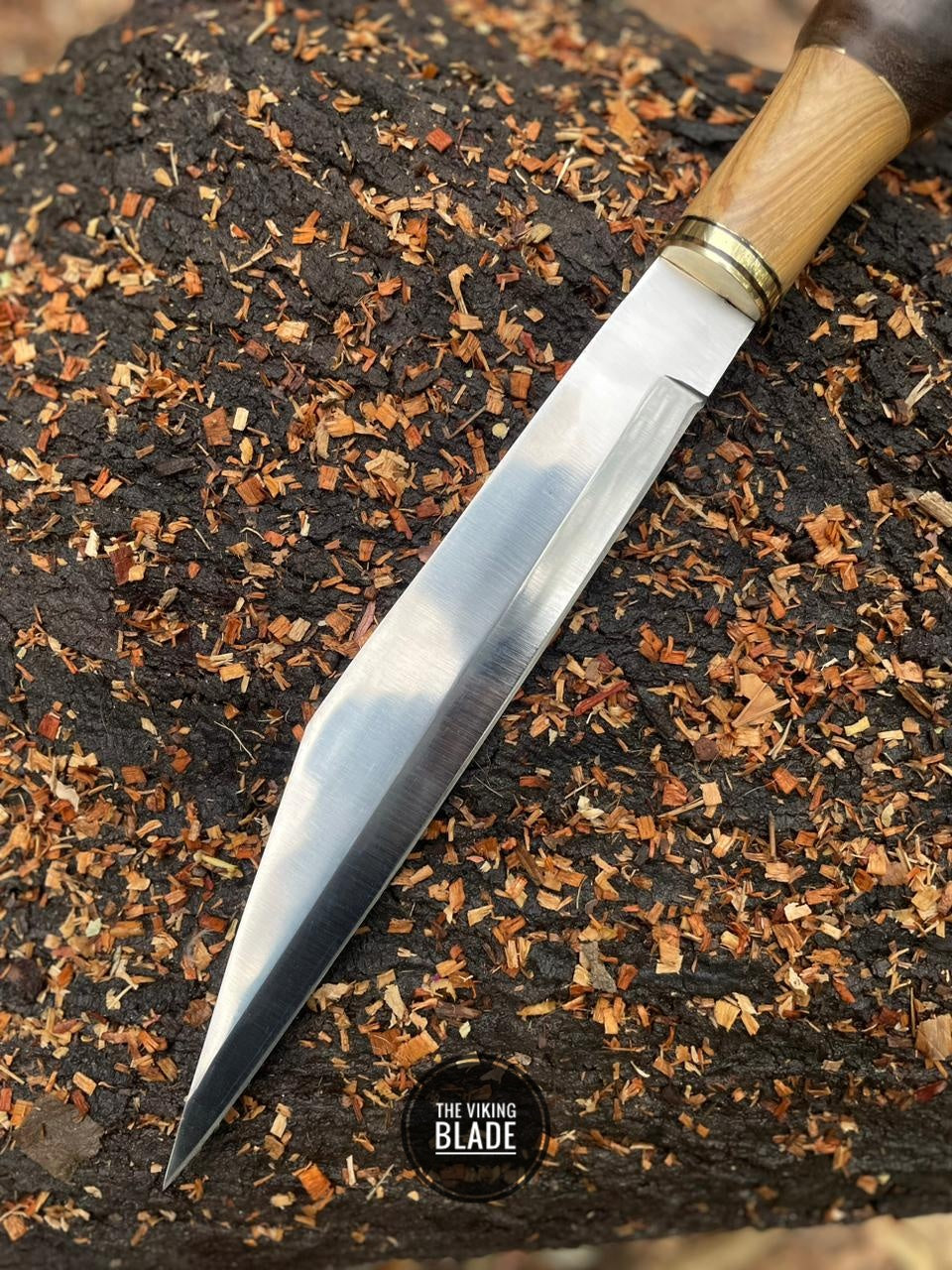 Wooden handle Seax knife with solid brass guard and bolster for durability.