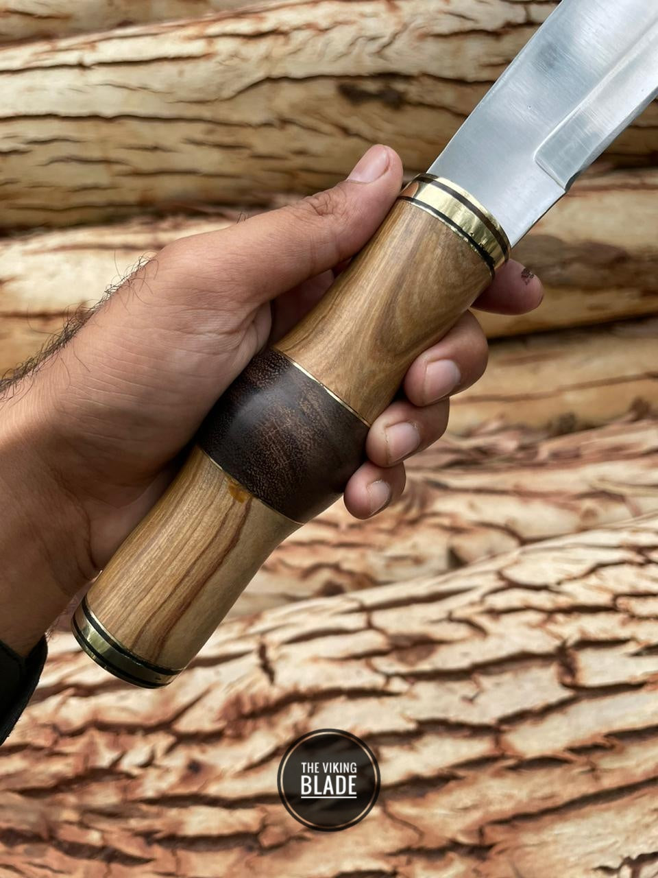 Custom J2 steel Seax knife featuring a polished wood handle and brass bolster.