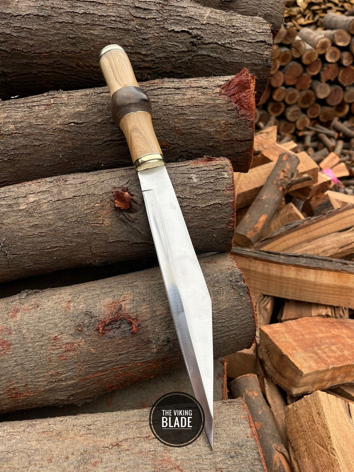 Handmade J2 stainless steel Seax knife with wooden handle and brass guard.