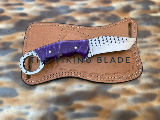 A custom handmade rasp steel tanto knife with a purple handle and a brown leather sheath with the text 'Viking Blade' embossed on it.