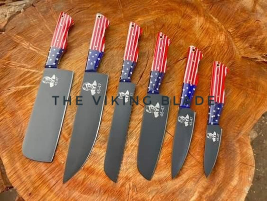 A set of custom handmade kitchen knives with Trump photo engravings and 'The Viking Blade' branding, displayed on a wooden surface.