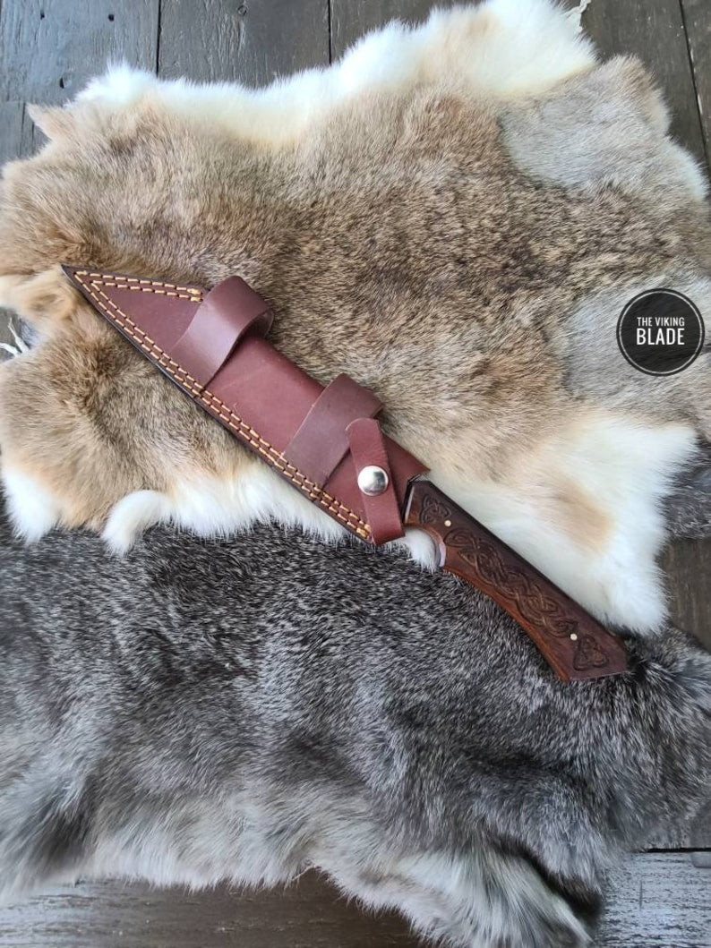 Viking-inspired Damascus Seax knife with detailed walnut grip and genuine leather sheath.