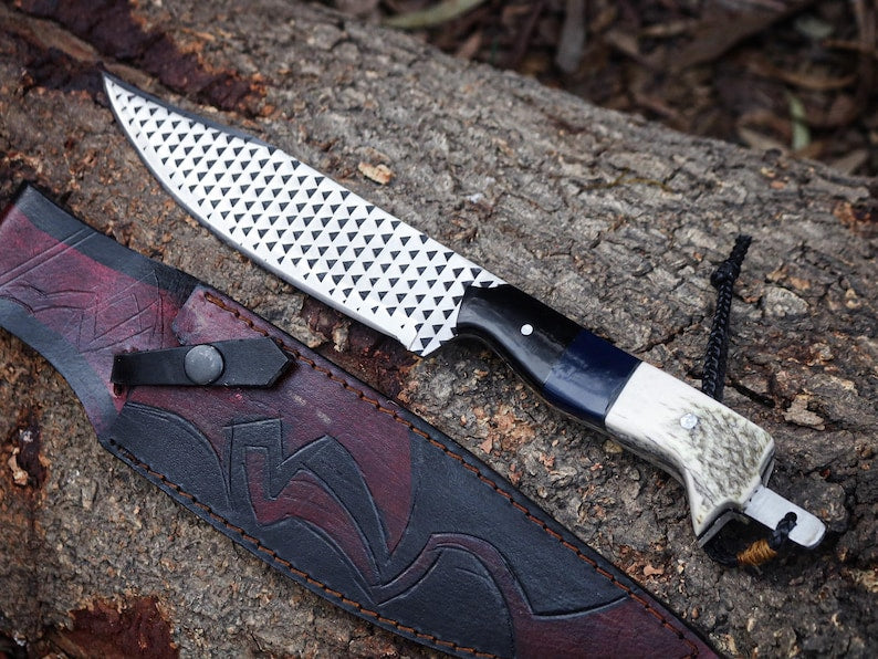 Knife with a decorative sheath on a textured surface