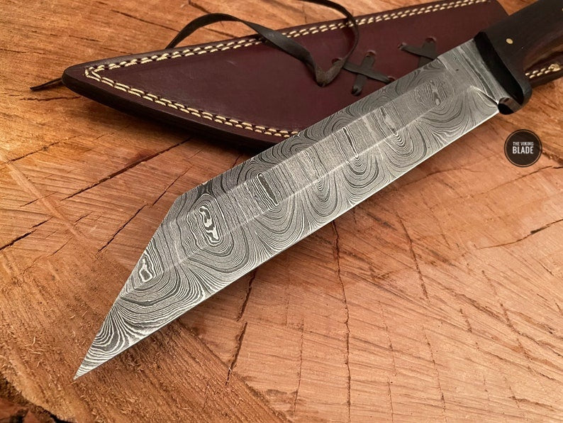 Custom Damascus steel Seax knife featuring a handcrafted wooden handle.