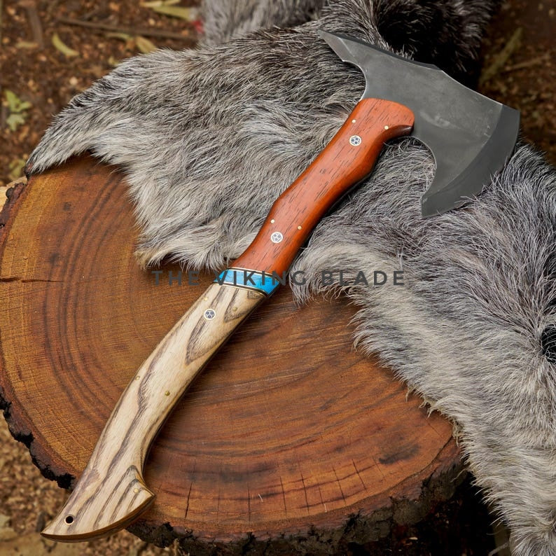 Wooden-handled axe with a metal head on a wooden surface