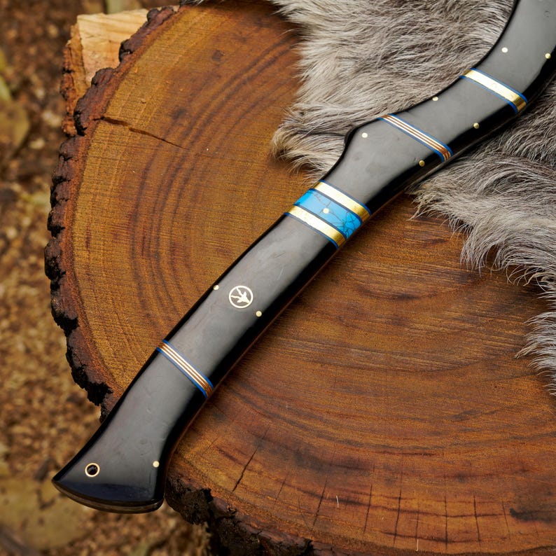 Decorative knife with fur handle on a wooden surface
