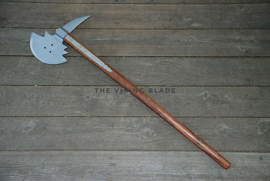 Viking axe on a wooden surface with 'The Viking Blade' branding.
