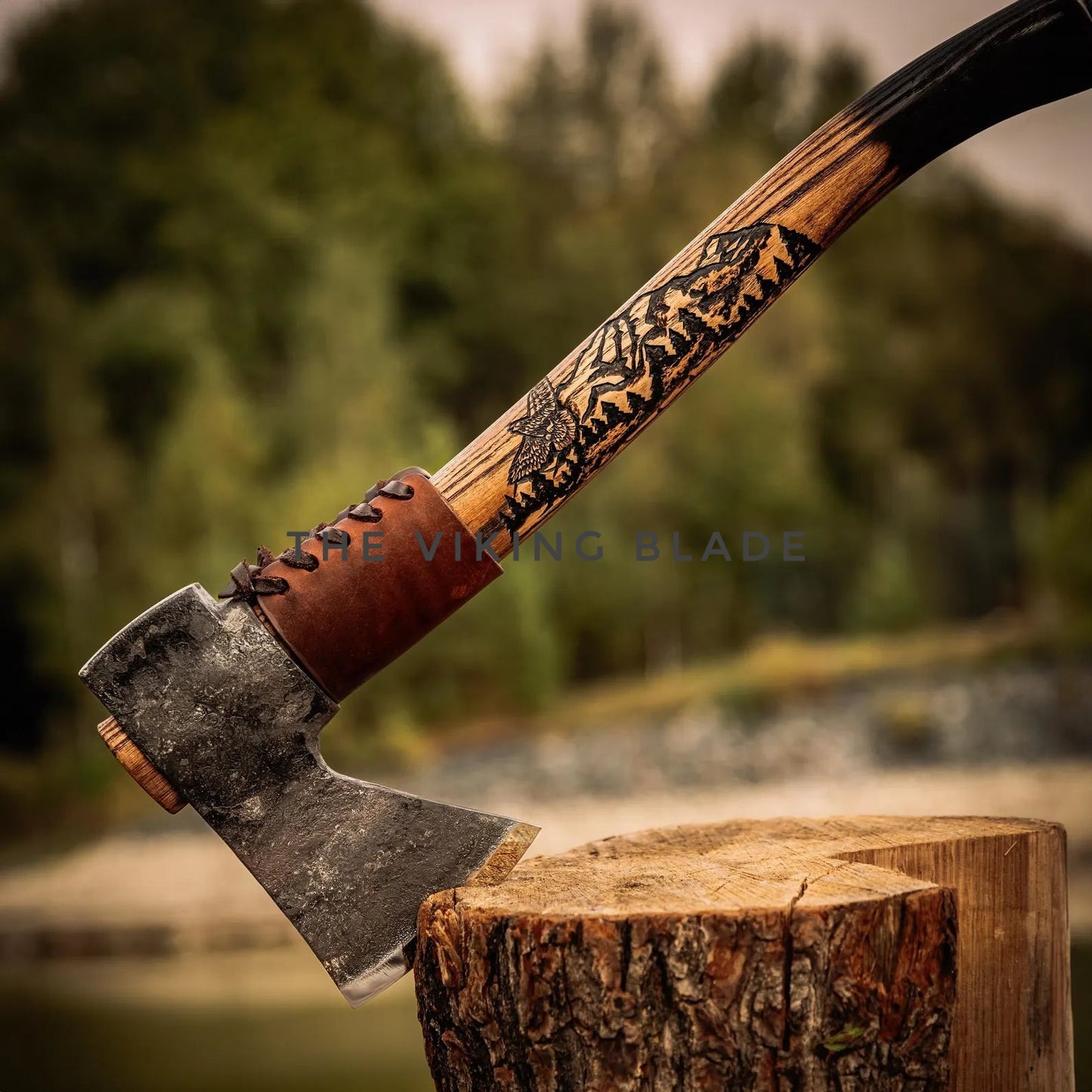 Decorative axe with a wooden handle on a wooden stump against a blurred natural background