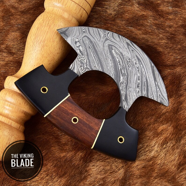 Multi-purpose Damascus Ulu knife featuring curved blade and genuine leather sheath