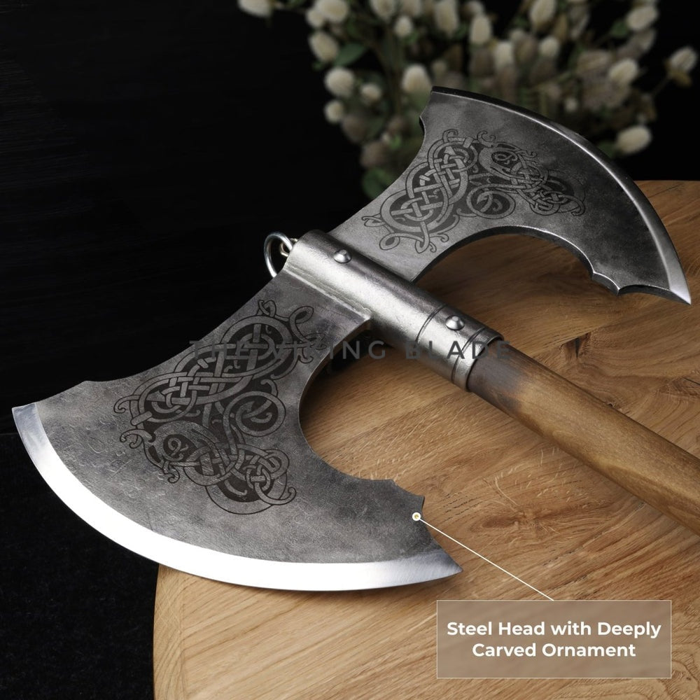 Decorative axe with deeply carved ornament on a wooden surface