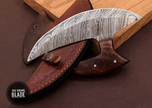Handmade Damascus Ulu knife with elegant wooden stand and leather sheath displayed on white background