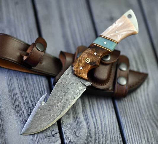 The Hunter's Edge: 8.25-Inch Gut Hook Skinning Hunting Knife with Raindrops Damascus Steel Blade, Rosewood and Epoxy Resin Handle | The Viking Blade |