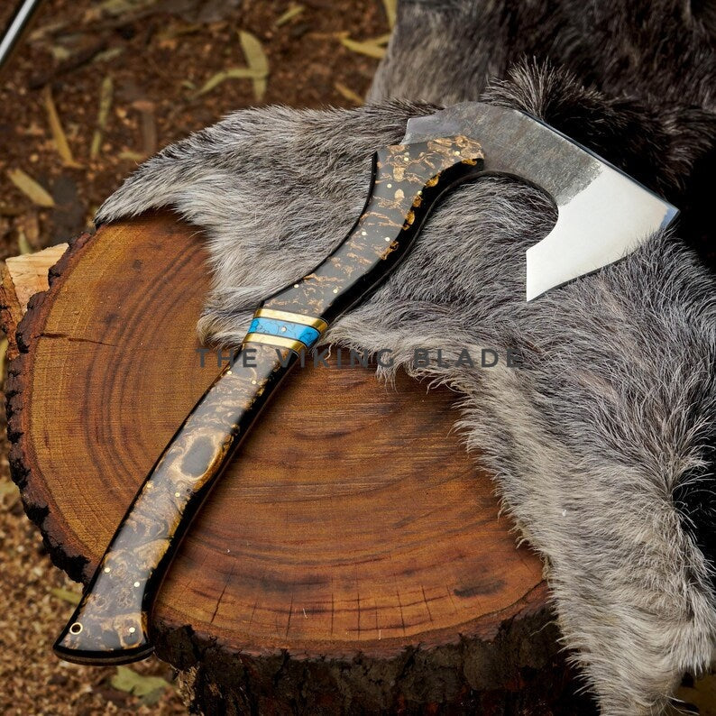 Decorative axe with a wooden handle and fur sheath on a wooden stump