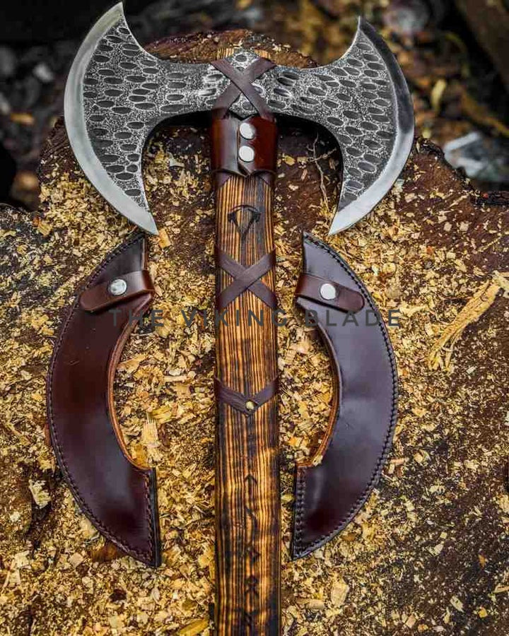 Decorative axe with leather handles on a textured surface
