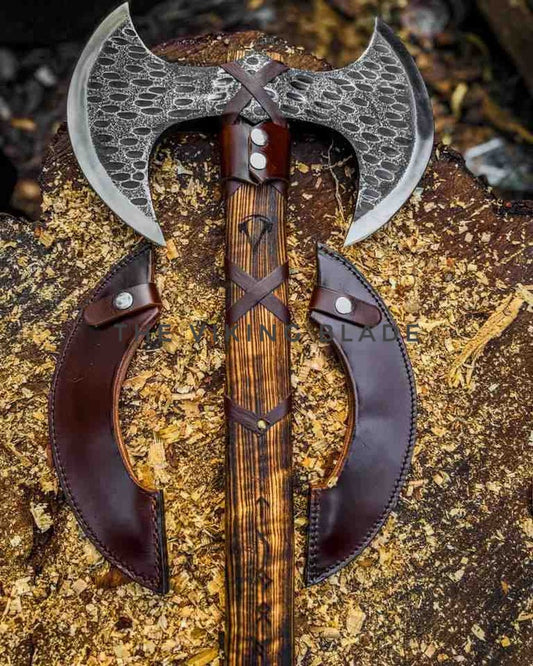 Decorative axe with leather handles on a textured surface