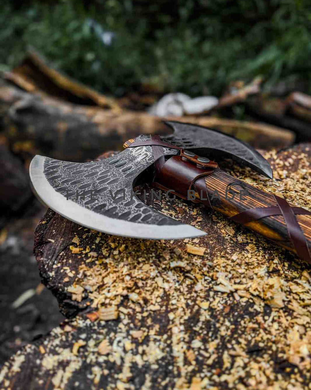 Decorative axe with wooden handle on a textured surface