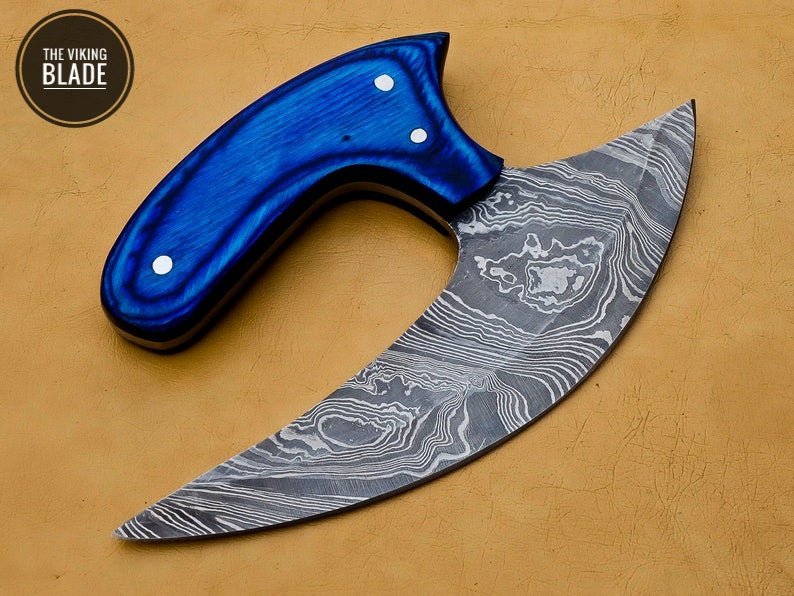 Handmade chef Ulu knife displayed with protective leather sheath