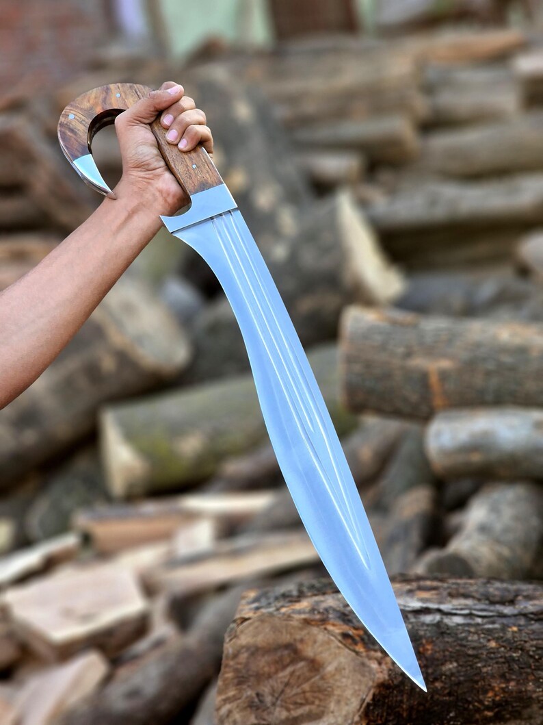 Custom curved hunting knife with hooked walnut wood handle and mirror polished blade