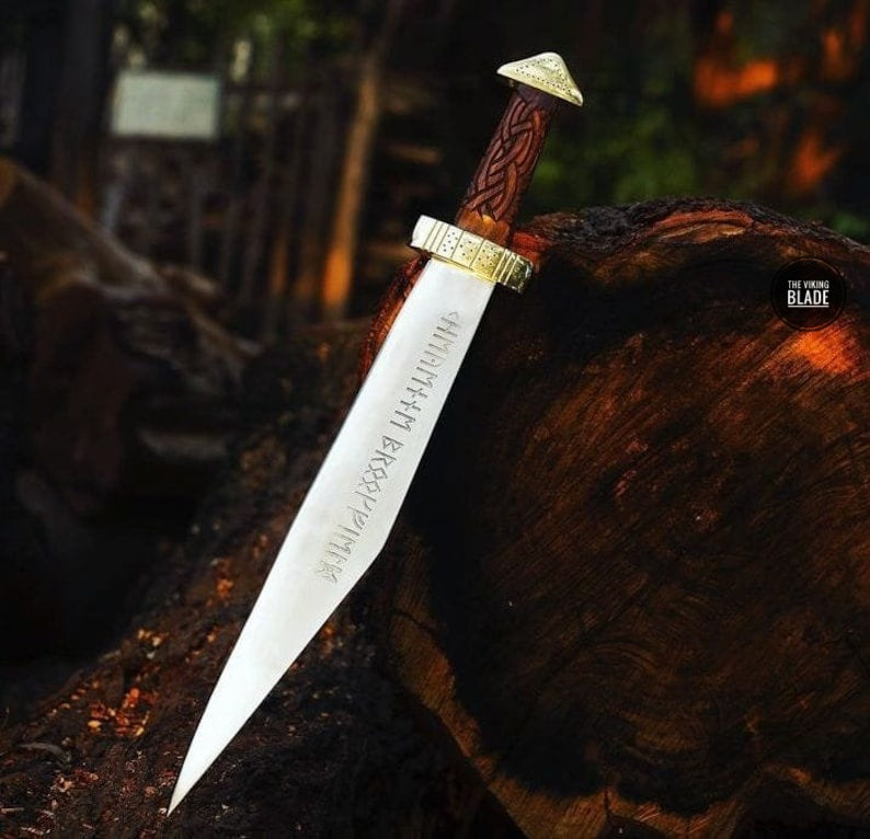 Premium Viking-inspired Seax knife with engraved rosewood handle, razor-sharp D2 steel blade, and handcrafted leather sheath.