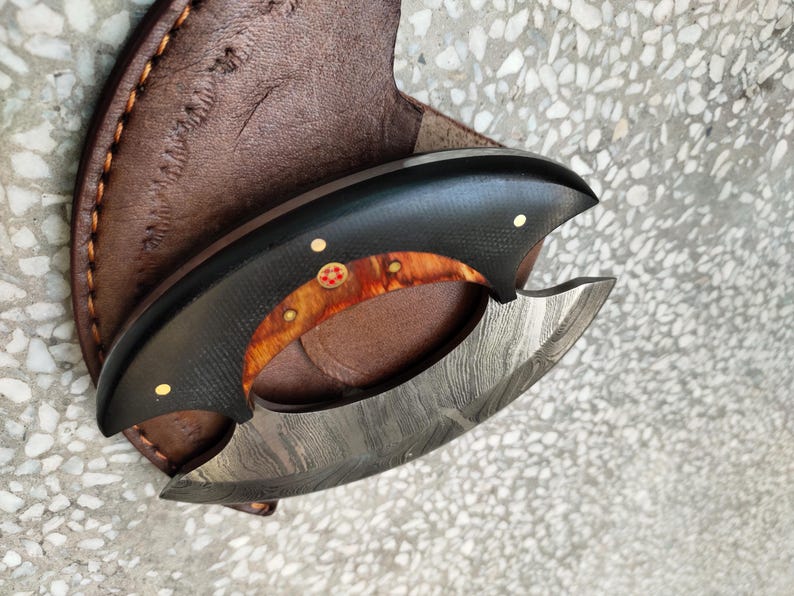 Damascus steel blade texture on custom owl hunting knife