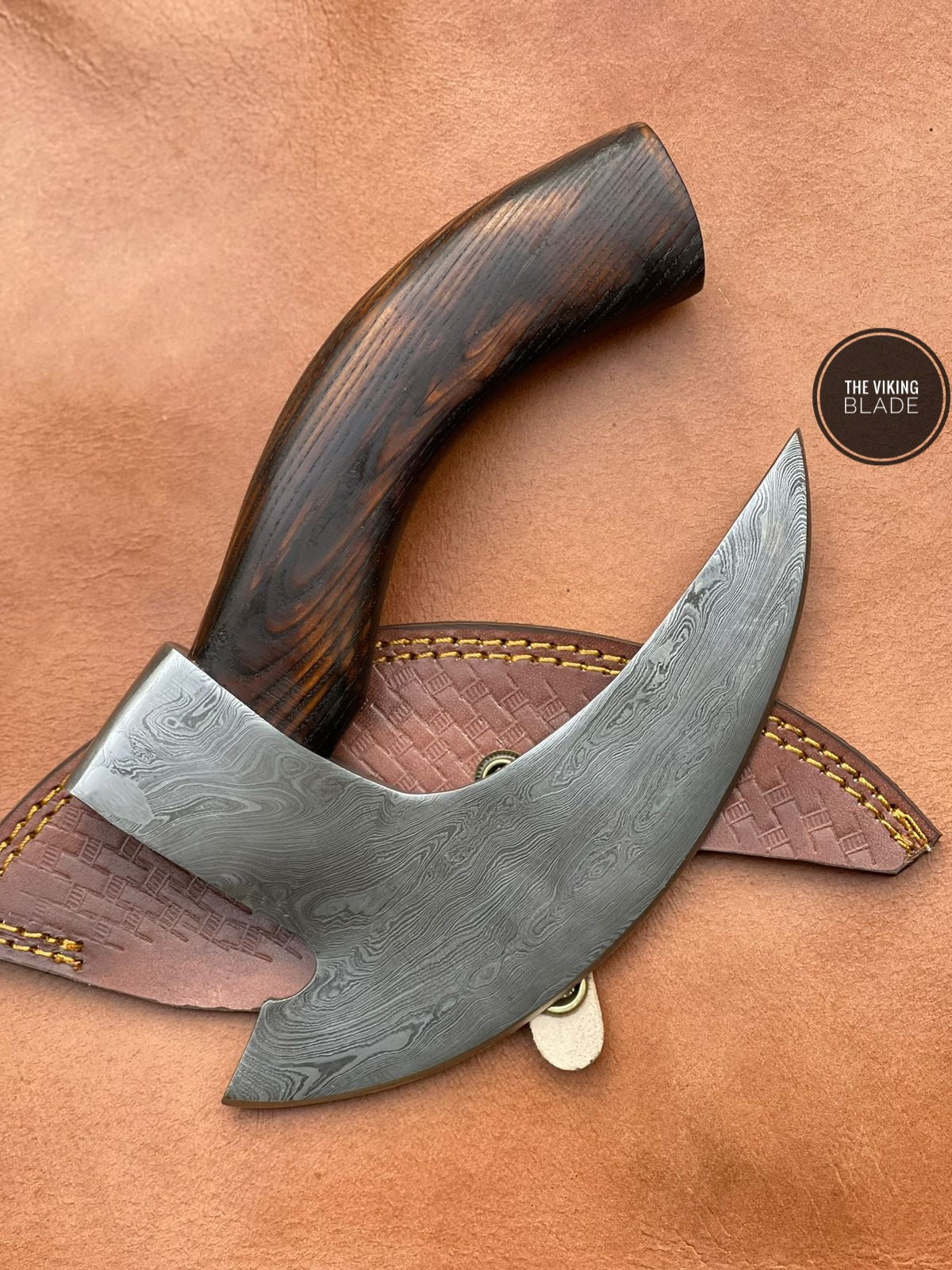 Handmade Damascus steel pizza axe cutter with sharp blade and wooden handle for smooth kitchen slicing.