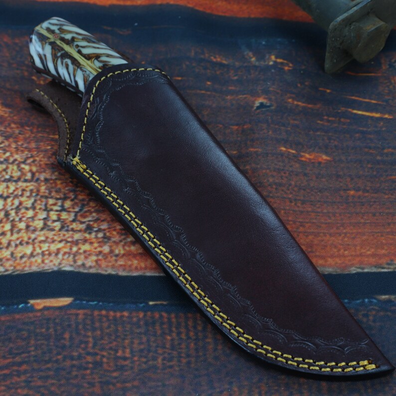 S-curve full-tang Damascus steel knife with leather sheath