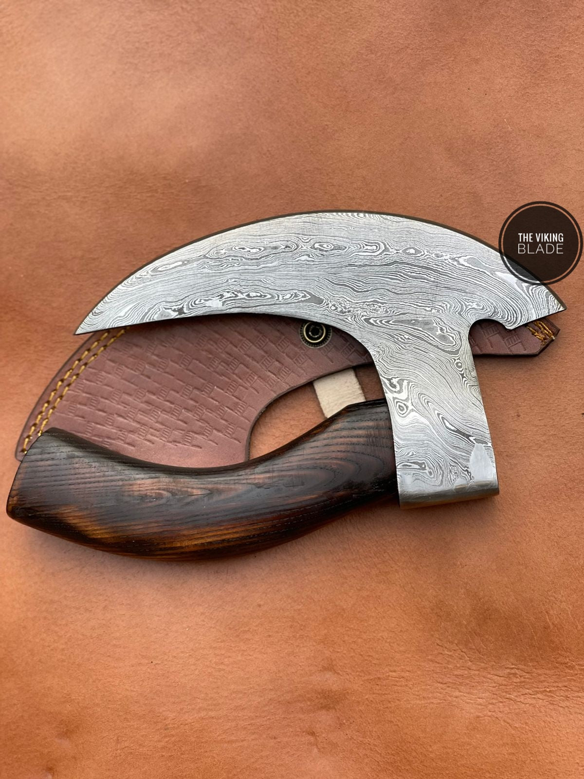 Premium Damascus steel pizza axe handmade tool with sharp edge and rustic wooden handle for kitchen use.
