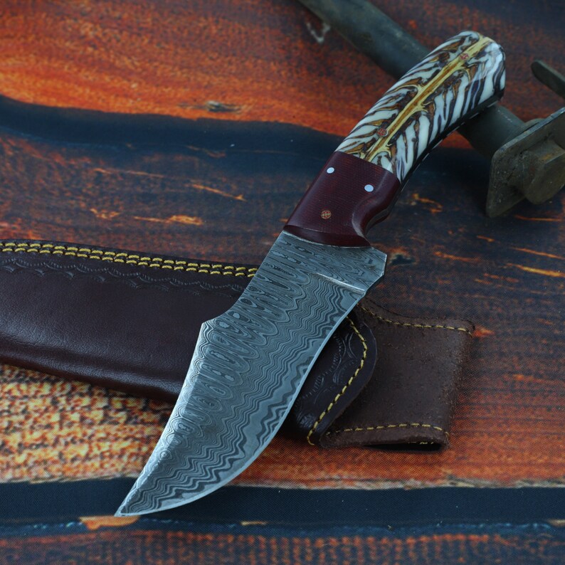 S-curve Damascus steel knife with unique white handle