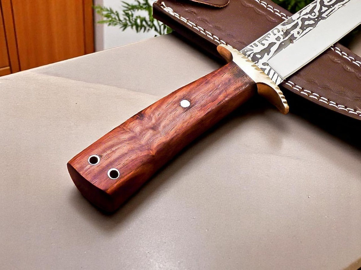 Knife with wooden handle and leather sheath on beige surface