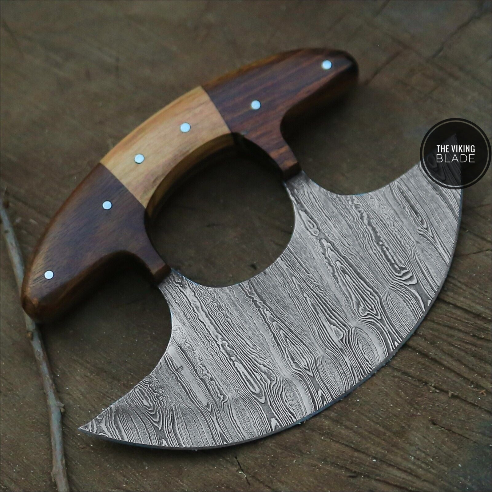 Damascus steel Ulu knife used as pizza and kitchen utility cutter
