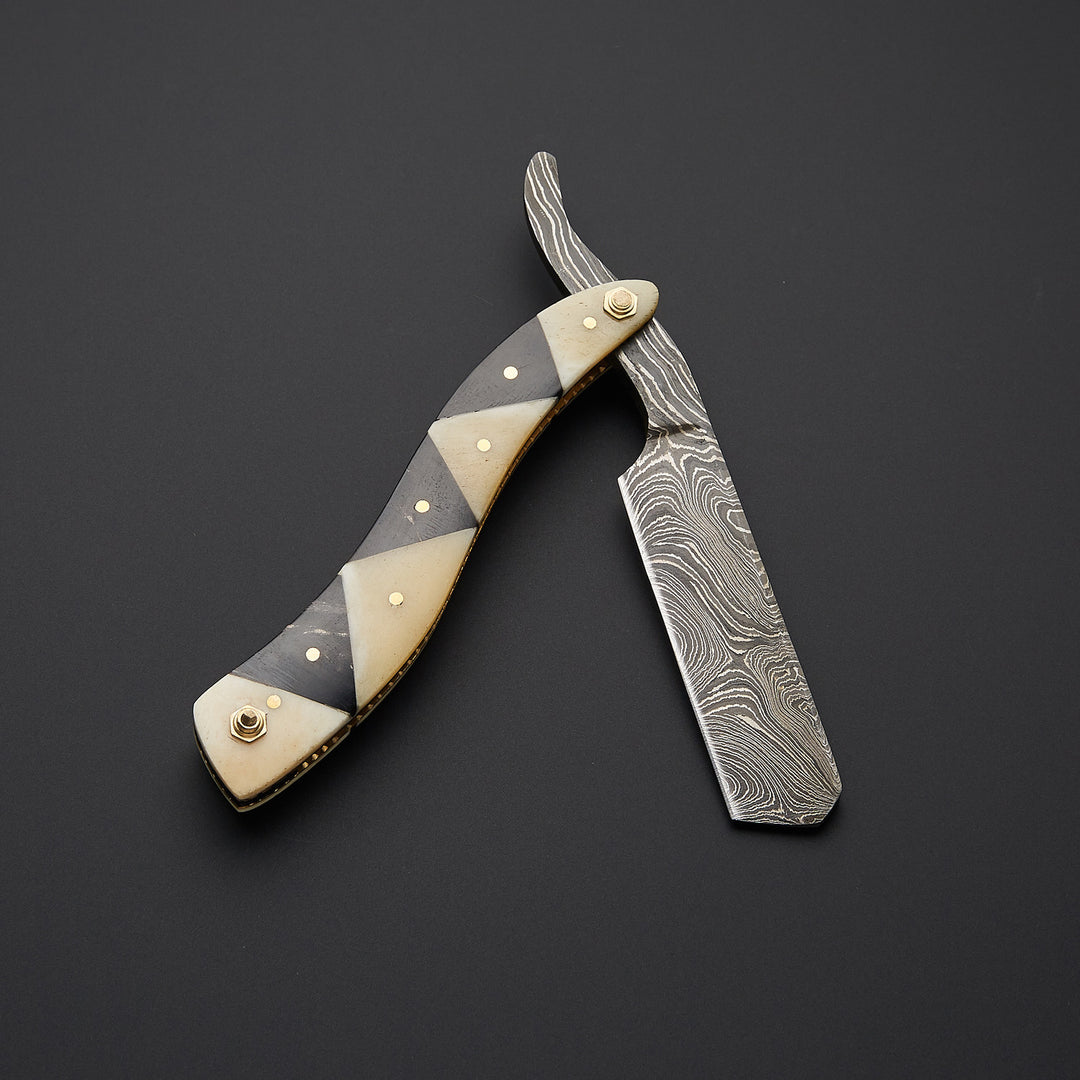 Luxury Damascus steel barber cut throat razor paired with high-quality leather sheath for safe storage and professional grooming use.