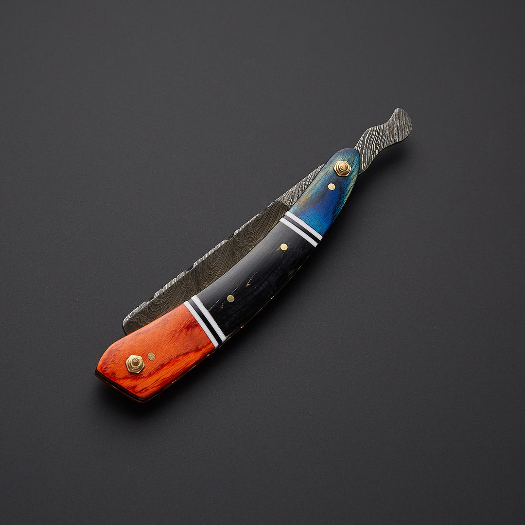 Handmade cut throat straight razor displayed in both open and closed positions highlighting folding mechanism and fine craftsmanship.