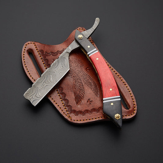 Custom handmade Damascus steel straight razor showing sharp straight edge blade with detailed wave pattern and polished wooden handle.