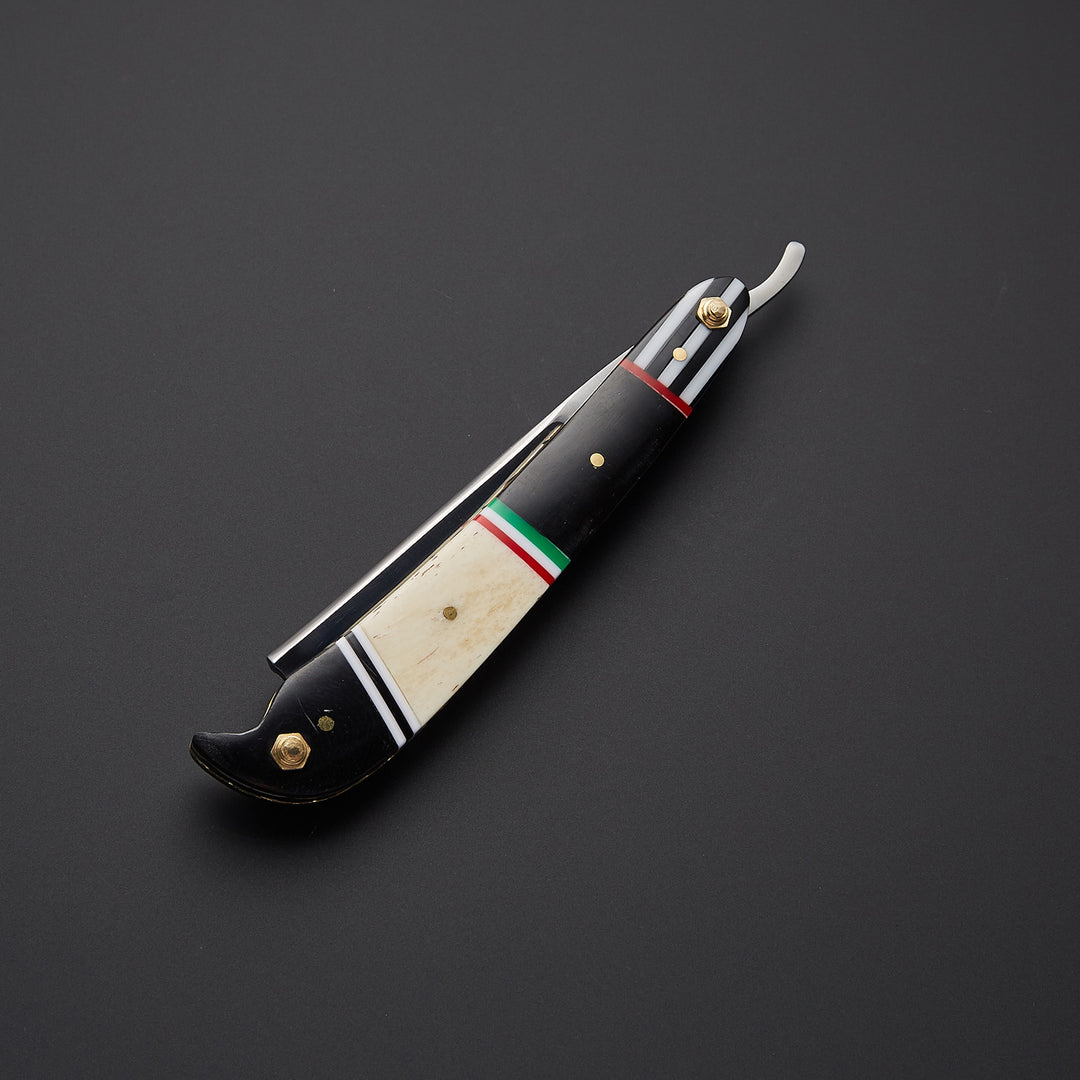 Folding barber straight razor made of J2 steel shown in open and closed positions highlighting craftsmanship and traditional design.