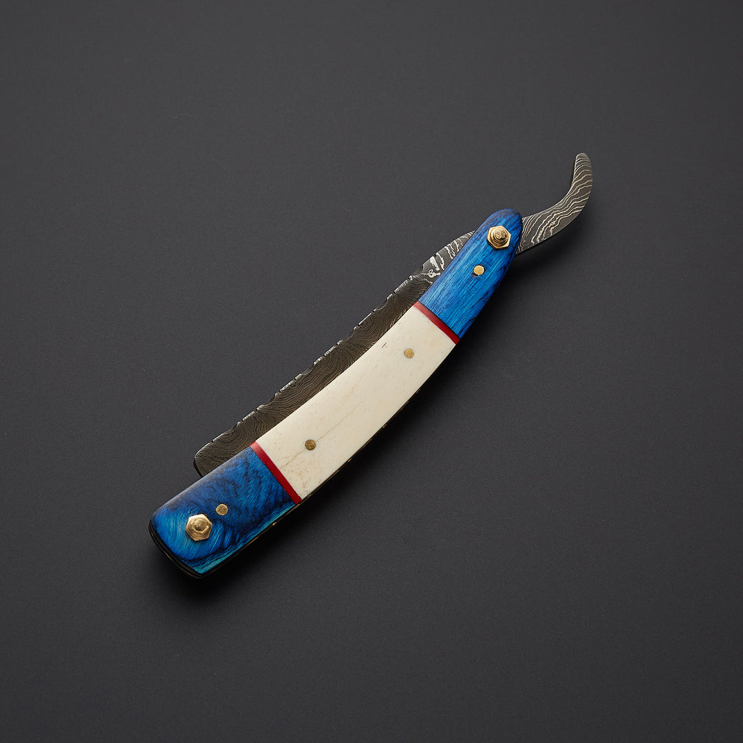 Handmade cut throat straight razor shown in open and closed positions highlighting folding mechanism and craftsmanship.